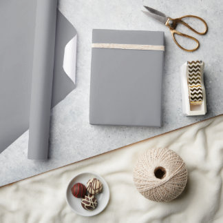 plain grey sheet of material partially unrolled wrapping paper