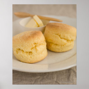 Plain scone with butter on plate poster