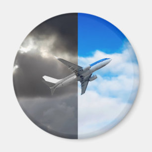 Plane flying out of stormy sky into blue sky magnet