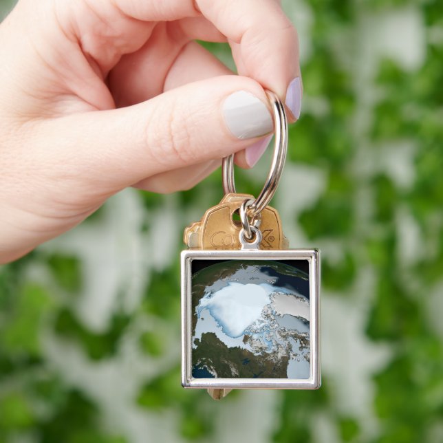Planet Earth Showing Sea Ice Coverage In 1980. Key Ring (Hand)