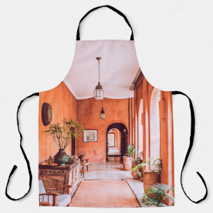 PLANTERS WITH PLANT NEAR AREA RUG INSIDE ROOM APRON