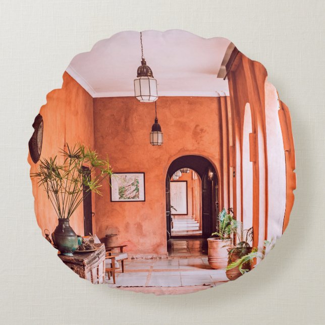 PLANTERS WITH PLANT NEAR AREA RUG INSIDE ROOM ROUND CUSHION (Front)