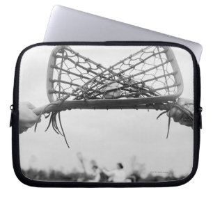 Play starts in a lacrosse team with the draw.Two Laptop Sleeve