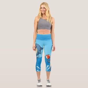 Playful Cartoon Dolphin with Beach Ball Capri Leggings