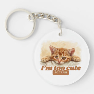 Playful Cat “I'm Too Cute to Train” Key Ring