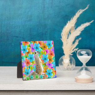 Playful Garden: Meerkat Amid Tricolored Blossoms Plaque