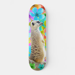 Playful Garden: Meerkat Amid Tricolored Blossoms Skateboard