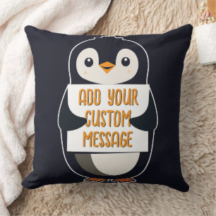 Playful penguin with a sign for your message cushion
