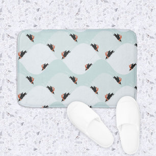 Playful Penguins Sliding on Snow Pattern Bath Mat