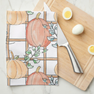 Playful pumpkin and plaid tea towel