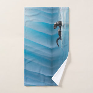 Playful Sea Otter Hand Towel