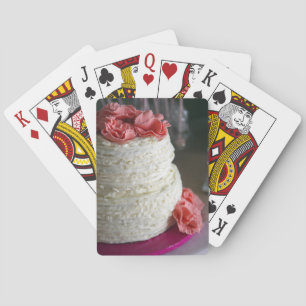 Playing Cards with pink and white cake on the back