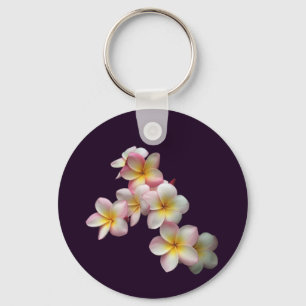 Plumeria blossoms on dark purple key ring