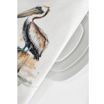 Poise of the Pelican  Tea Towel<br><div class="desc">Bring the calm of the coast into your kitchen with this elegant kitchen towel featuring the Poise of the Pelican design. The artwork captures a stately pelican perched on a weathered dock, evoking the gentle beauty of seaside life. Made to complement coastal, nautical, or nature-inspired spaces, this towel blends functionality...</div>
