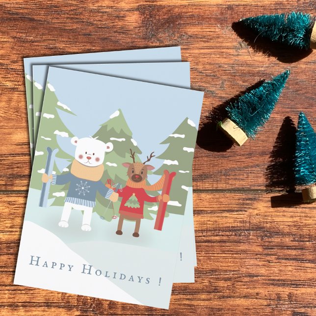 Polar Bear and Reindeer Friend Kid Holiday Card (Polar bear and reindeer kid Holiday cards laying flat on a desk .)