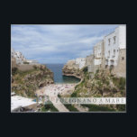 Polignano a Mare city beach in Puglia bar postcard<br><div class="desc">Postcard of the urban beach and the bay bordered by white houses on rocky cliffs in the coastal town Polignano a Mare in Puglia,  Southern Italy with a fading bar and the text: 'Polignano a Mare'.</div>