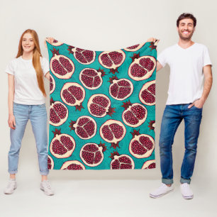 Pomegranate slices on turquoise fleece blanket