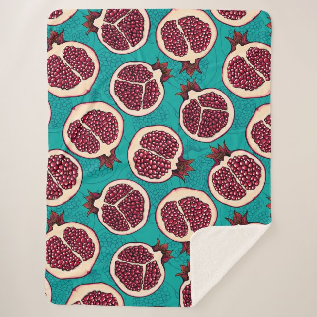 Pomegranate slices on turquoise sherpa blanket (Front)