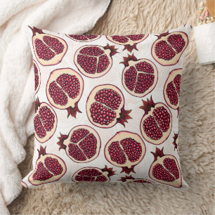 Pomegranate slices on white cushion