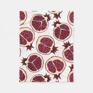 Pomegranate slices on white fleece blanket