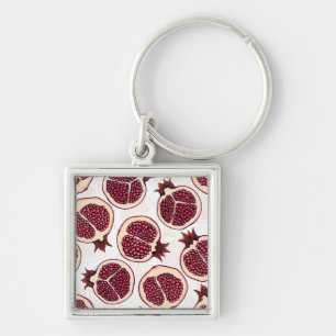 Pomegranate slices on white key ring