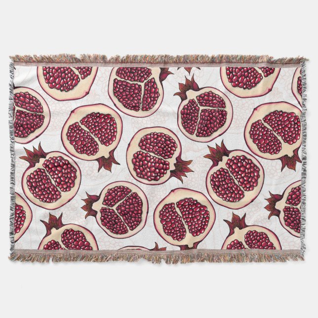 Pomegranate slices on white throw blanket (Front)