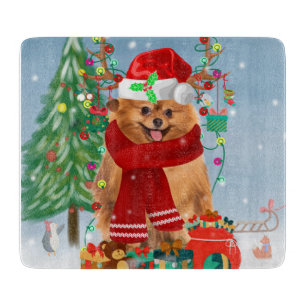 Pomeranian dog with Christmas gifts Cutting Board