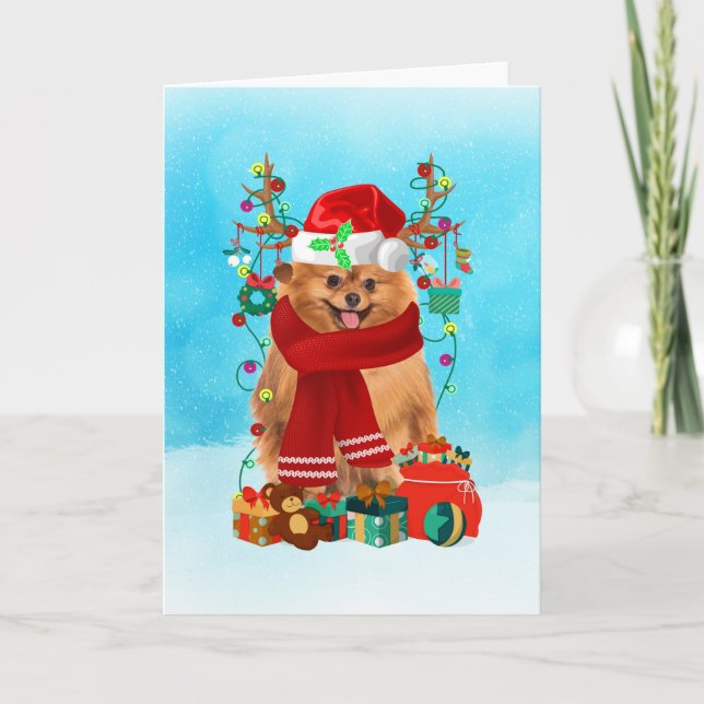 Pomeranian in snow with Christmas gifts  Card (Front)