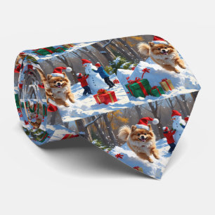 Pomeranian Running in Snow with Christmas Hat Tie