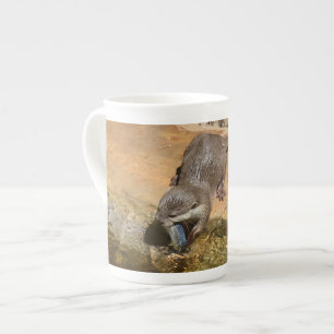 **"Pondside Feast: An Otter and His Catch"**  Bone China Mug