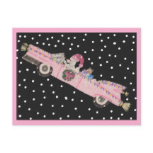 Poodle at Christmas in a pink convertible