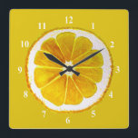 Pop art yellow lemon fruit original watercolour square wall clock<br><div class="desc">A cute and colorful vibrant yellow lemon fruit slice from an original painting by artist Sacha Grossel. This large pop art style fruit is yellow and very bright and colorful against a customizable yellow colored background. Quirky and original.</div>