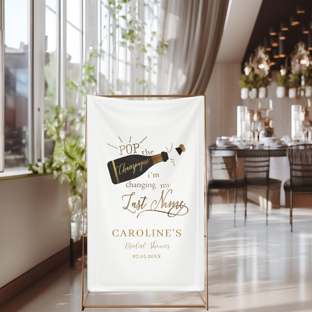 Pop the champagne i´m changing my last name!  banner ("Pop the champagne, i´m changing my last name!" White, Bridal Shower Banner.)