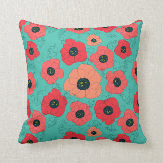 poppy spin coral on teal cushion