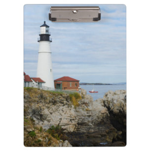 Portland Headlight lighthouse on rocky shore Clipboard