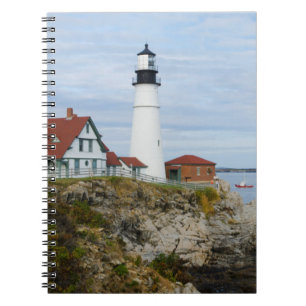 Portland Headlight lighthouse on rocky shore Notebook