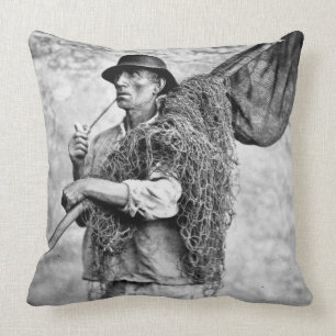 Portrait of a Fisherman Carrying his Nets (b/w pho Cushion