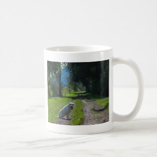 Portrait of a golden retriever sitting down coffee mug