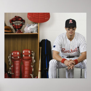 Portrait of baseball player sitting in locker poster