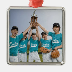 Portrait of players with trophy metal tree decoration