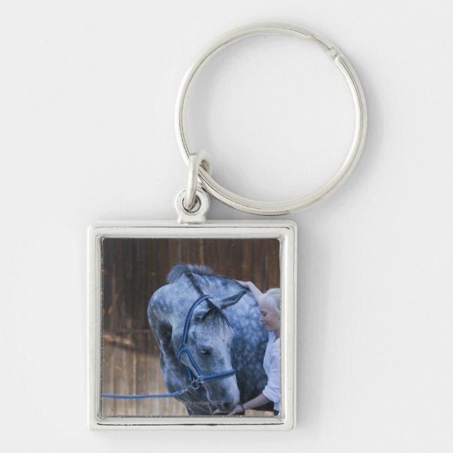 portrait of young girl holding white horse key ring (Front)