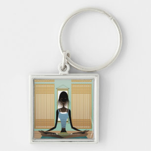 Portrait of young woman doing yoga key ring