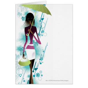 Portrait of young woman holding purse and umbrella