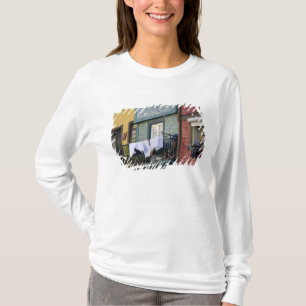 Portugal, Oporto (Porto). Woman hanging laundry T-Shirt