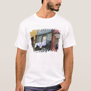 Portugal, Oporto (Porto). Woman hanging laundry T-Shirt
