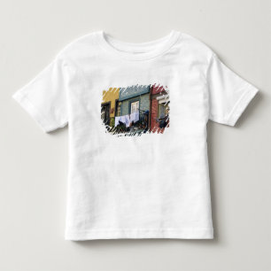 Portugal, Oporto (Porto). Woman hanging laundry Toddler T-Shirt