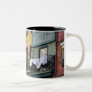Portugal, Oporto (Porto). Woman hanging laundry Two-Tone Coffee Mug