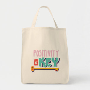 positivity is the key design tote bag