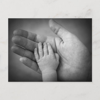 Postcard baby's hand in mothers hand.