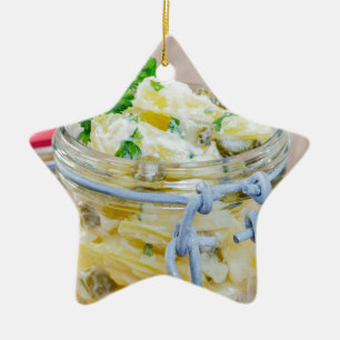 Potato salad in a jar on wooden ceramic ornament